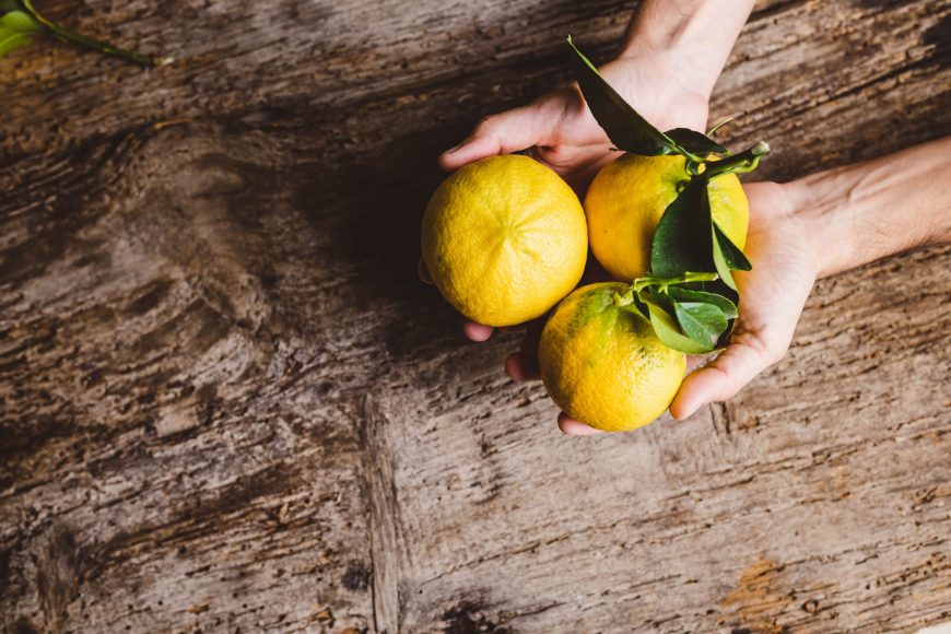 bergamot-fruit-of-calabria-on-a-wooden-table-2021-08-30-06-15-12-utc-min